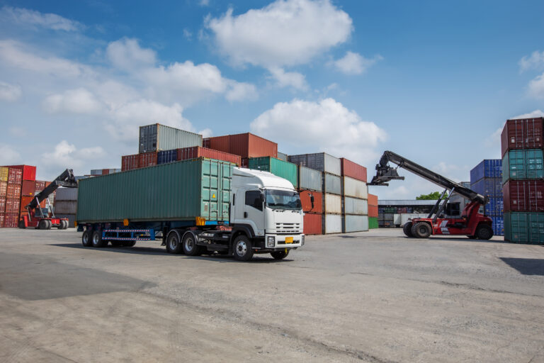 a red container forklift loads a cargo container o 2026 03 25 08 23 04 utc
